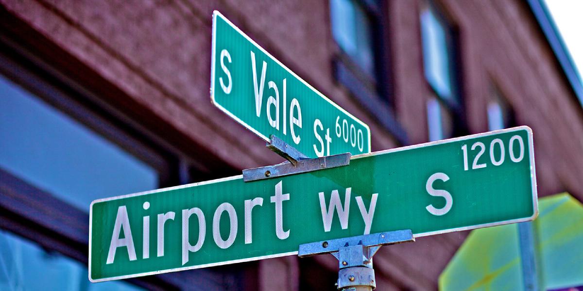 Airport Way and Vale St street signs at intersection