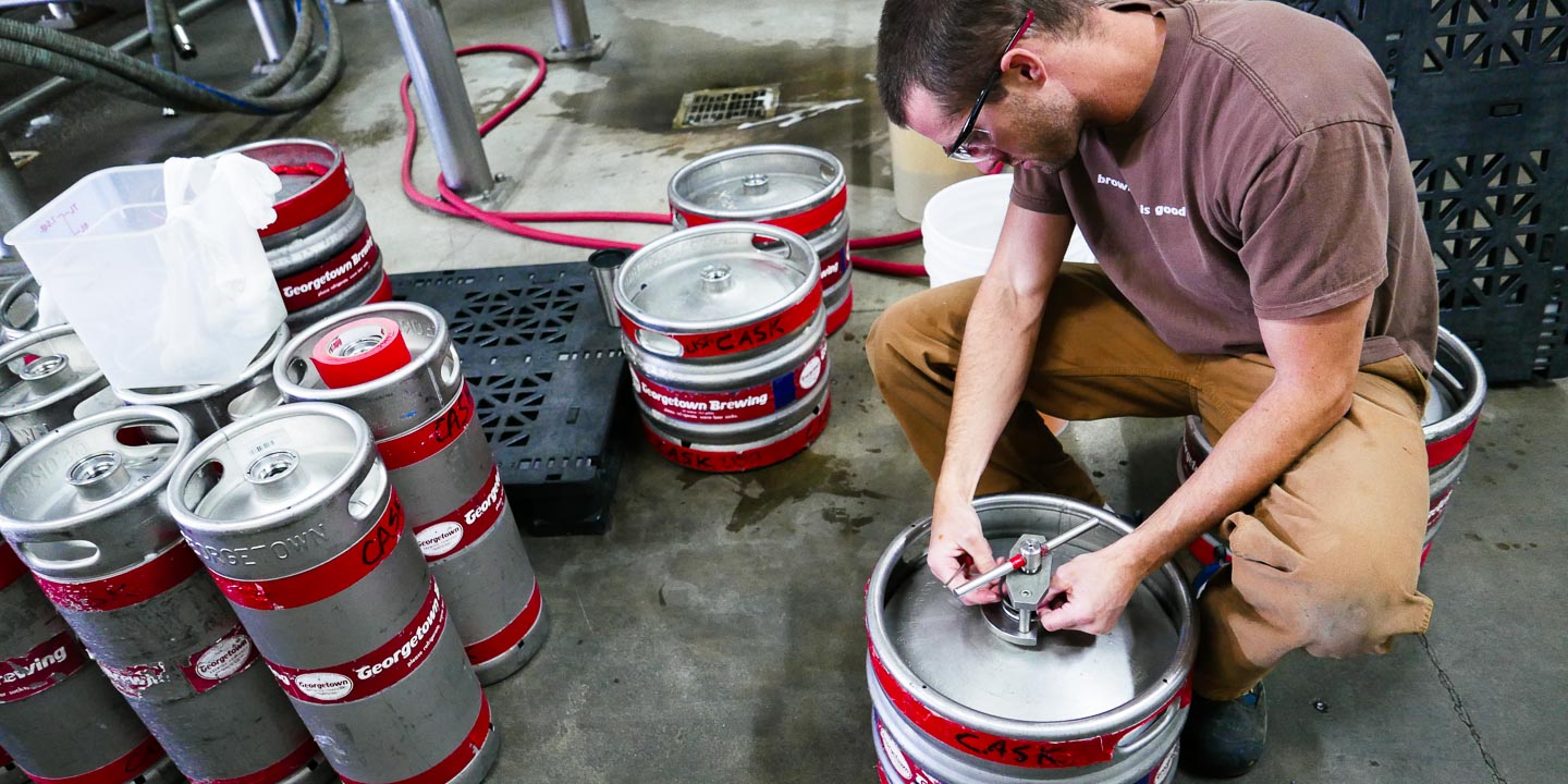 Brewing Manager Tom removes the stem valve from a keg so he can use it as a cask